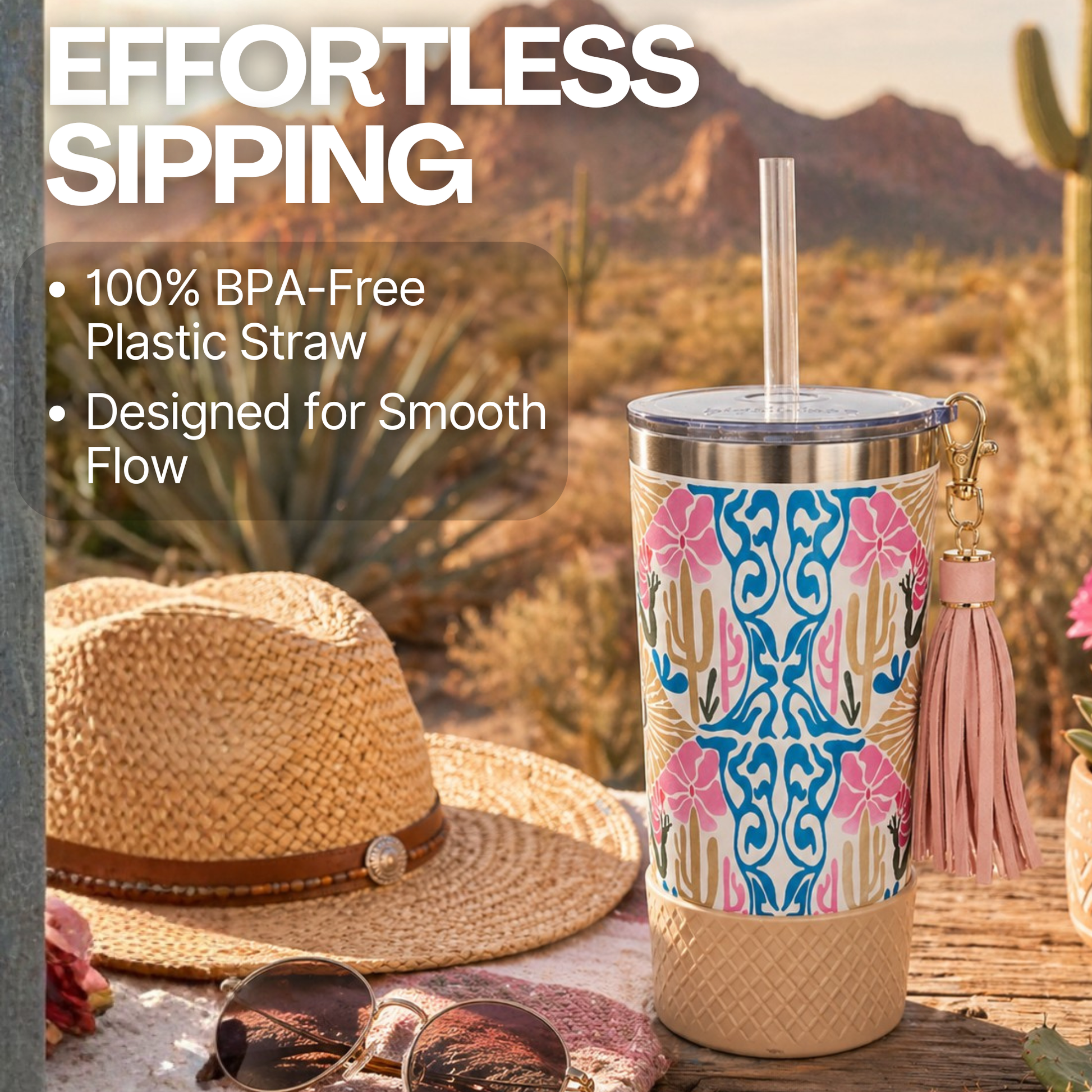 Biddlebee 20oz charm tumbler with cactus design, straw, and hat in desert 