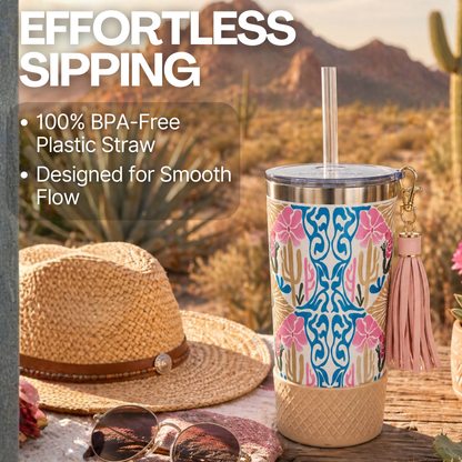 Biddlebee 20oz charm tumbler with cactus design, straw, and hat in desert 