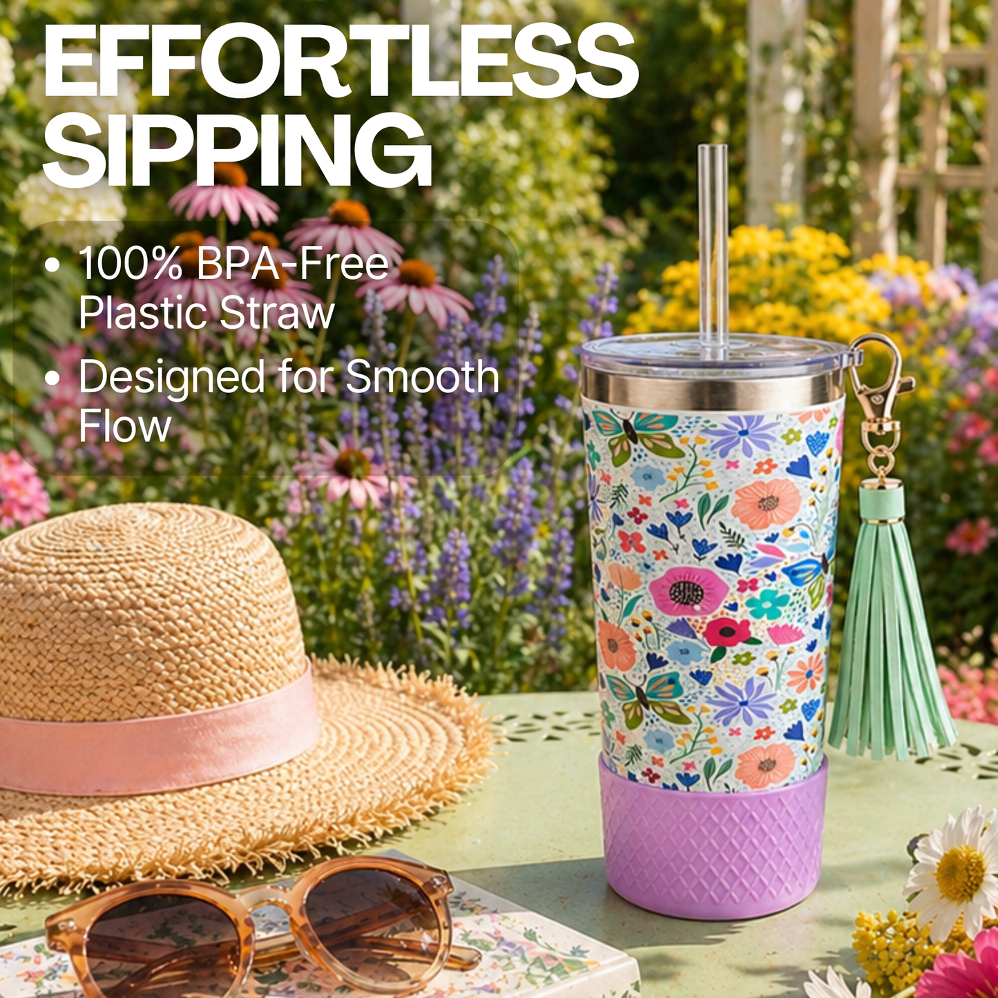 Biddlebee 20oz butterfly and Floral-patterned charm tumbler  with a straw, placed outdoors with a hat and sunglasses.