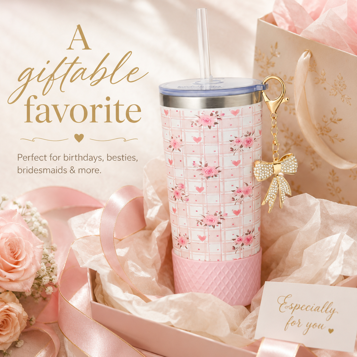 Pink floral tumbler with bow keychain in a gift box surrounded by flowers and ribbons.