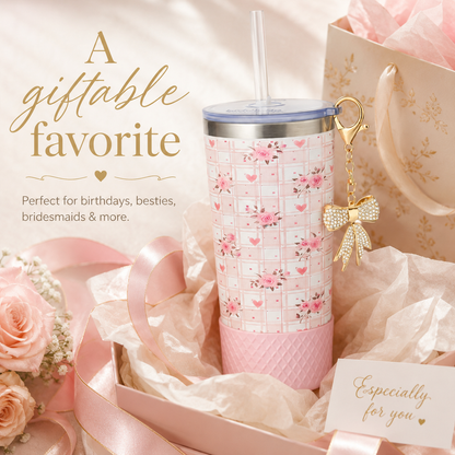 Pink floral tumbler with bow keychain in a gift box surrounded by flowers and ribbons.