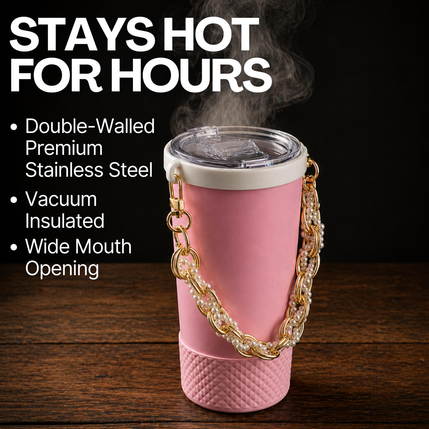 Biddlebee Brew Pink Tumbler with a black background on a wooden surface featuring insulated stays hot for hours
