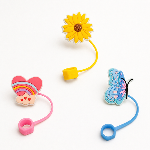 Biddlebee Three colorful straw toppers with a sunflower, heart, and butterfly design on a white background.