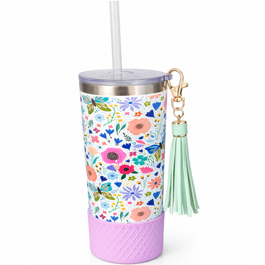 Biddlebee 20oz garden blooms straw tumbler with a pink base, straw, and green tassel keychain on a white background
