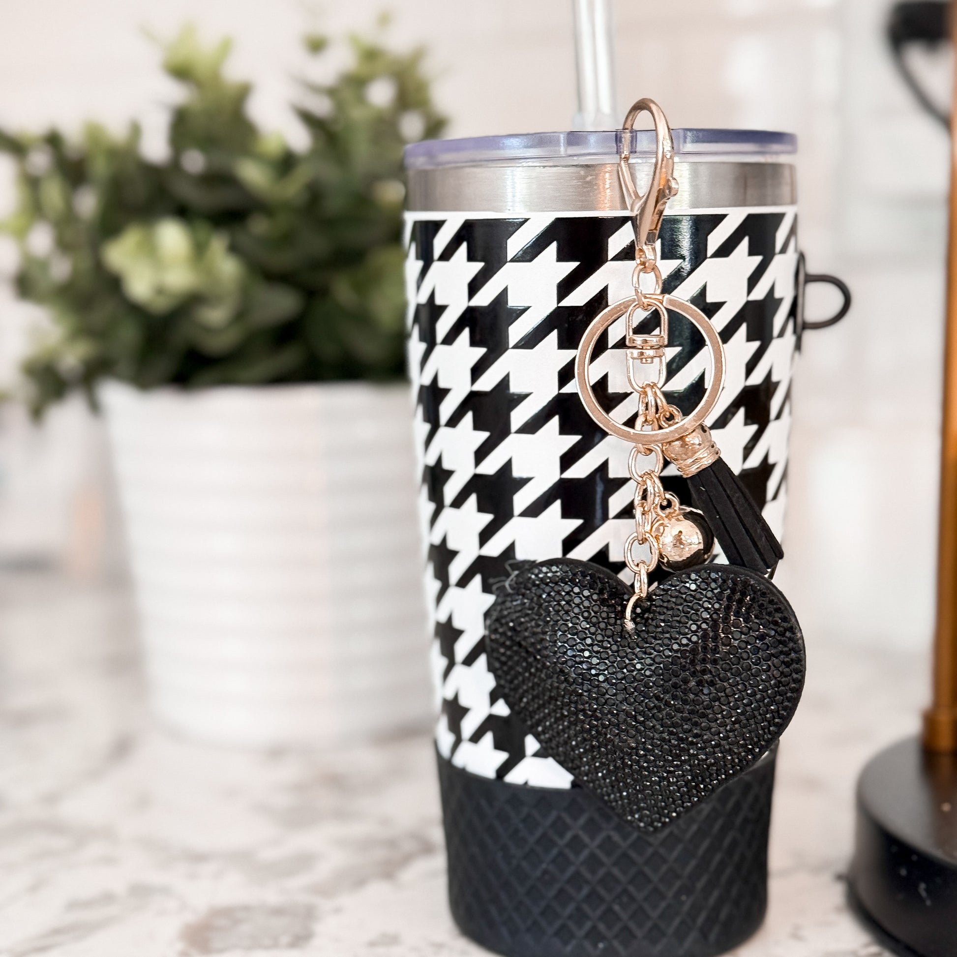 Biddlebee 20oz black and white charm tumbler with easy sip straw, shimmer heart tassel charm, protective silicone boot
