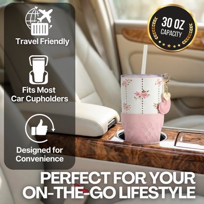 Biddlebee 30oz pink roses charm tumbler with easy sip straw lid, removable heart charm, and protective silicone boot in a car cupholder, surrounded by text highlighting features.