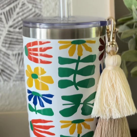 Biddlebee 20oz retro floral charm tumbler with green silicone boot, brown ombre tassel charm and easy sip straw lid
