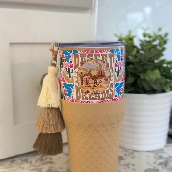 Biddlebee 30oz Desert dreams Charm tumbler with easy sip straw, boho tassel charm, and silicone boot.  Features southwestern boho print pattern. 