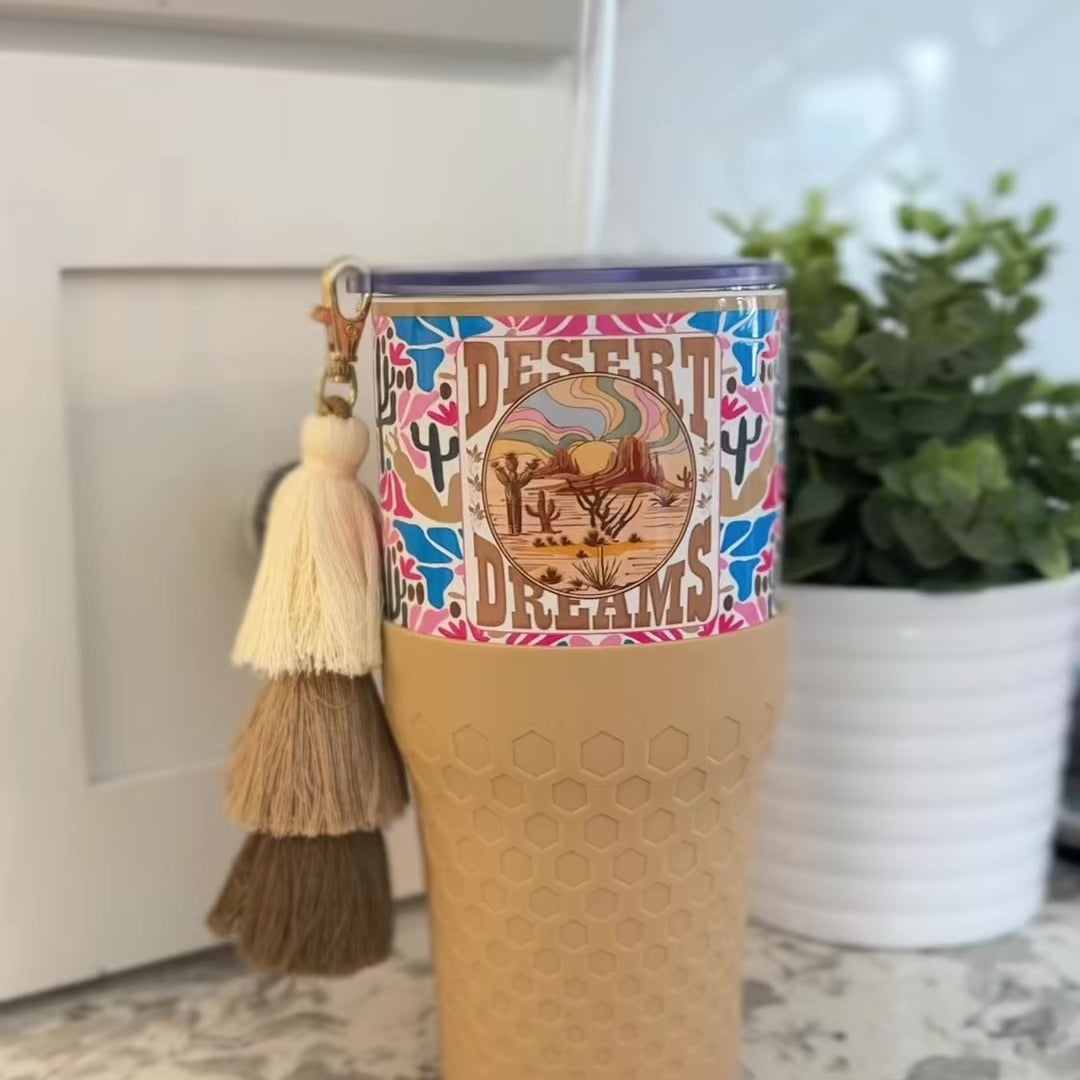 Biddlebee 30oz Desert dreams Charm tumbler with easy sip straw, boho tassel charm, and silicone boot.  Features southwestern boho print pattern. 